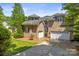 Brick home with a three-car garage and manicured landscaping at 7365 Gabriel St, Sherrills Ford, NC 28673