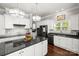 Modern kitchen with white cabinets, granite countertops and stainless steel appliances at 7365 Gabriel St, Sherrills Ford, NC 28673