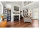 Living room features a fireplace, hardwood floors, and a staircase at 7365 Gabriel St, Sherrills Ford, NC 28673