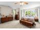 Spacious bedroom with lots of natural light and classic wood furniture at 7365 Gabriel St, Sherrills Ford, NC 28673