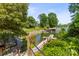 Picturesque waterfront with boat dock, mature trees, and view of serene lake are yours to enjoy at 7365 Gabriel St, Sherrills Ford, NC 28673