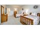 Comfortable bedroom featuring twin beds with decorative pillows and wooden furniture, bathed in soft, natural light at 801 Hidden Pond Ln, Waxhaw, NC 28173