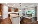 This spacious kitchen boasts a large island with granite countertops and seating, perfect for entertaining and casual dining at 801 Hidden Pond Ln, Waxhaw, NC 28173