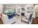 Inviting living room with a fireplace, built-in shelves, and comfortable seating at 801 Hidden Pond Ln, Waxhaw, NC 28173