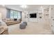 Spacious living room with built-in bookshelves, a large window, and comfortable seating for relaxing and entertaining at 801 Hidden Pond Ln, Waxhaw, NC 28173