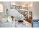 Spacious living area showcasing a staircase, hardwood floors, and an open floor plan at 801 Hidden Pond Ln, Waxhaw, NC 28173