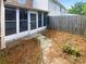 Enclosed outdoor patio space with a screened-in porch and mature landscaping, perfect for relaxation at 8049 Regent Park Ln, Charlotte, NC 28210