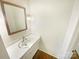Bright bathroom features a white sink vanity, stylish mirror, and modern lighting at 8049 Regent Park Ln, Charlotte, NC 28210