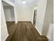Bright dining area with hardwood floors offers seamless flow to the kitchen and living spaces at 8049 Regent Park Ln, Charlotte, NC 28210