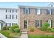 Charming brick townhome with black shutters and well-maintained landscaping, offering a welcoming curb appeal at 8049 Regent Park Ln, Charlotte, NC 28210