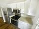 Kitchen area features stainless steel appliances and granite countertops at 8049 Regent Park Ln, Charlotte, NC 28210