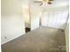 The main bedroom features neutral carpet, ensuite bath access, and spacious closet at 8049 Regent Park Ln, Charlotte, NC 28210