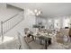 Well-staged dining area with open floor plan, modern light fixture, and plenty of natural light at 8118 Jacey Ln # 21, Huntersville, NC 28078