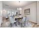 Beautifully staged dining room featuring modern light fixture and seating with an open floorplan at 8118 Jacey Ln # 21, Huntersville, NC 28078