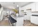 Modern kitchen features stainless steel appliances, island seating and bright, open design at 8118 Jacey Ln # 21, Huntersville, NC 28078
