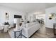 Staged living room filled with neutral furniture and decor, with dining area visible in the background at 8118 Jacey Ln # 21, Huntersville, NC 28078