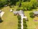 Expansive aerial view of a brick ranch-style home with lush landscaping and a long driveway at 819 Riddle Mill Rd, Clover, SC 29710
