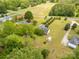 Aerial view of a home on a sprawling lot with mature trees and a neighboring field at 819 Riddle Mill Rd, Clover, SC 29710