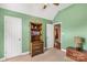 Bedroom features a tall bookshelf, a ceiling fan and beige carpet at 819 Riddle Mill Rd, Clover, SC 29710