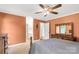 Bedroom featuring a wooden dresser with two windows, ceiling fan, and private bathroom at 819 Riddle Mill Rd, Clover, SC 29710