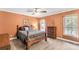 Comfortable bedroom with warm lighting, ceiling fan, and carpeted floor at 819 Riddle Mill Rd, Clover, SC 29710