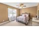 Cozy bedroom with a floral bedding, ceiling fan, and a large window at 819 Riddle Mill Rd, Clover, SC 29710