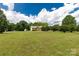 View of a home from the extensive front yard at 819 Riddle Mill Rd, Clover, SC 29710