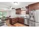 Beautiful kitchen with custom cabinets, granite counters, stainless appliances, and wood flooring at 819 Riddle Mill Rd, Clover, SC 29710