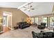 Comfortable and well-lit living room featuring a fireplace, seating, and peaceful ambiance at 819 Riddle Mill Rd, Clover, SC 29710