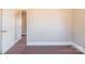 Empty bedroom featuring carpet flooring and doorway at 819 W Rankin Ave, Gastonia, NC 28052