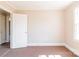 Bedroom with an ensuite bathroom and neutral walls and carpet flooring at 819 W Rankin Ave, Gastonia, NC 28052