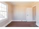 Empty bedroom featuring carpet, a window, and neutral paint at 819 W Rankin Ave, Gastonia, NC 28052
