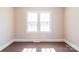 Bedroom featuring carpet flooring and window, showcasing neutral colors at 819 W Rankin Ave, Gastonia, NC 28052