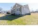 Exterior view showcasing the home's siding, shutters, and yard at 819 W Rankin Ave, Gastonia, NC 28052