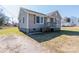 Charming single-story home with neutral siding, green shutters and a small front porch at 819 W Rankin Ave, Gastonia, NC 28052