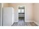 Bright kitchen showcasing white appliances and ample cabinet space at 819 W Rankin Ave, Gastonia, NC 28052