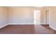 Bright living room with neutral walls, carpet flooring, and ample natural light at 819 W Rankin Ave, Gastonia, NC 28052