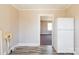 Pantry featuring white appliances and ample cabinet space at 819 W Rankin Ave, Gastonia, NC 28052