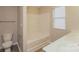 Bright bathroom featuring a double sink vanity and a large soaking tub with shower at 838 Von Buren Blvd, Rock Hill, SC 29730