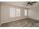 A bright bedroom features neutral paint, updated floors, and a large windows at 838 Von Buren Blvd, Rock Hill, SC 29730