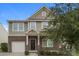 Charming two-story home featuring brick and siding, a front porch, and an attached garage at 838 Von Buren Blvd, Rock Hill, SC 29730
