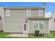 Back exterior view of this two-story home features a well-maintained lawn and neutral siding at 838 Von Buren Blvd, Rock Hill, SC 29730