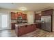 A spacious kitchen with stainless steel appliances and a center island with granite countertops at 838 Von Buren Blvd, Rock Hill, SC 29730