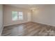 A bright living room with neutral paint, updated floors, and a door leading to the outside at 838 Von Buren Blvd, Rock Hill, SC 29730