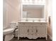 Bathroom with a large vanity, dual sinks, modern fixtures, and a toilet to the side at 856 Skyline Dr, Chester, SC 29706