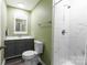 Bathroom with modern gray vanity, brushed nickel hardware, and walk-in shower with marble tile at 856 Skyline Dr, Chester, SC 29706