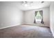 Carpeted bedroom with a ceiling fan and window at 856 Skyline Dr, Chester, SC 29706
