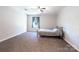 Bedroom features a metal frame bed, window with light curtains, and carpet at 856 Skyline Dr, Chester, SC 29706