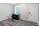 Bedroom boasts a desk and chair next to the window, and gray vinyl flooring at 856 Skyline Dr, Chester, SC 29706