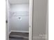 Storage closet with metal shelving and gray vinyl flooring at 856 Skyline Dr, Chester, SC 29706
